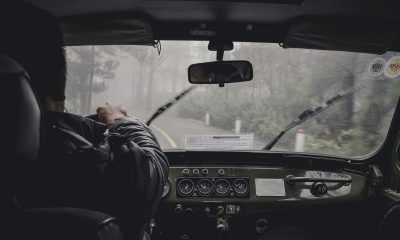 man driving car during rainy daytime