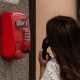 woman using payphone
