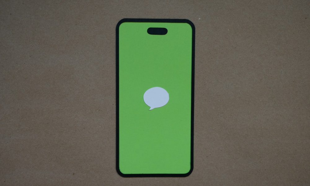 a green iphone case with a white speech bubble on it