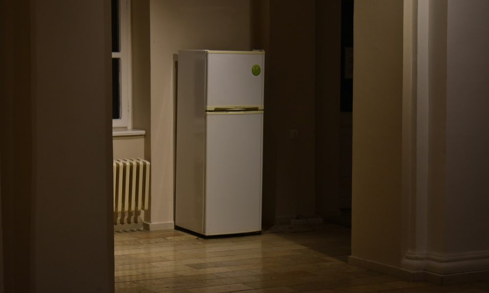 a white refrigerator freezer sitting inside of a kitchen