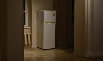 a white refrigerator freezer sitting inside of a kitchen