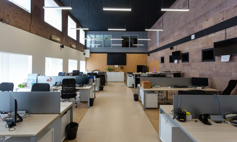 black flat screen computer monitor on white wooden desk