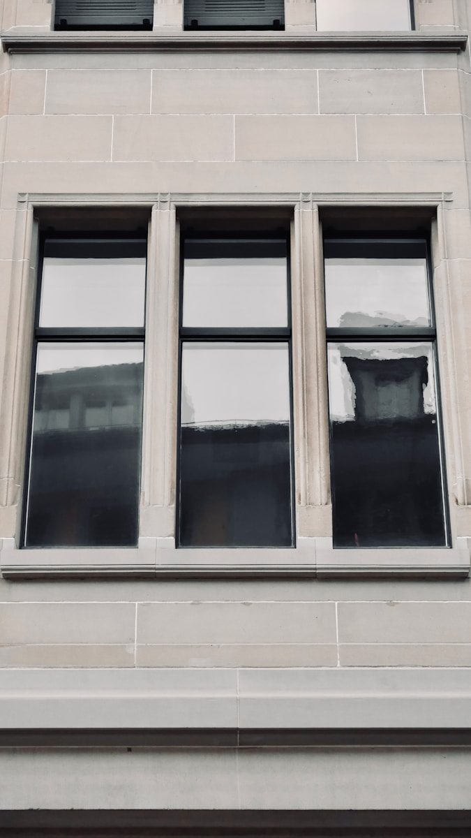 a tall building with a clock on the side of it